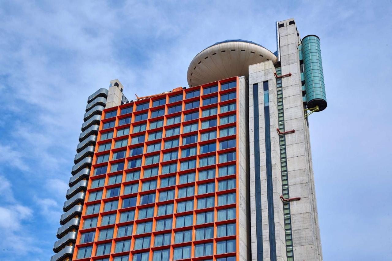 Hyatt Regency Barcelona Tower Hotel L'Hospitalet de Llobregat Exterior photo The distinctive orange windows of the Lada Bank headquarters in Moscow